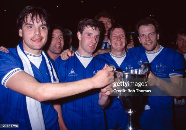 Everton's Graeme Sharp, Kevin Sheedy, Trevor Steven and Andy Gray celebrate with the trophy after the Everton v Rapid Vienna UEFA European Cup...