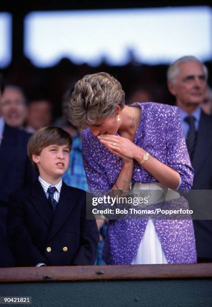 Princess Diana with her son Prince William in the Royal Box on Centre Court at the All England Club during the Wimbledon Lawn Tennis Championships,...