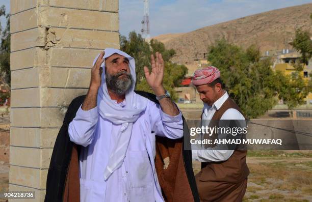 Iraqi Yazidis visit their temple during a ceremony on January 12 in the town of Bashiqa, some 20 kilometres north east of Mosul. / AFP PHOTO / Ahmad...