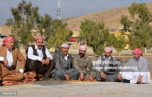 Iraqi Yazidis visit their temple during a ceremony on January 12 in the town of Bashiqa, some 20 kilometres north east of Mosul. / AFP PHOTO / Ahmad...