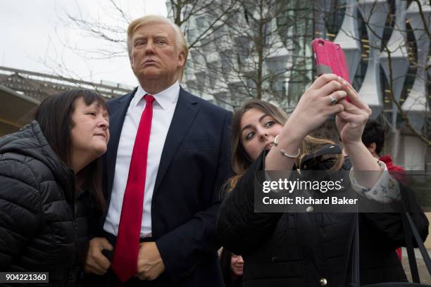 The waxwork of Donald Trump stands outside the US Embassy at Nine Elms in south London on the day when the President announced on Twitter, his...