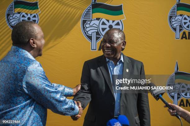 South African ruling party African National Congress President Cyril Ramaphosa and Kenya President Uhuru Kenyatta shake hands during a press briefing...