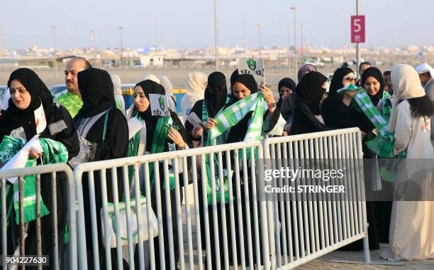 Female Saudi supporters of Al-Ahli queue at an entrance for families and women at the King Abdullah Sports City in Jeddah on January 12 ahead of...