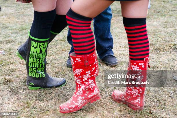 Close up of two festival goers in wellies in the crowd at the Reading Festival on August 29, 2009 in Reading, England.