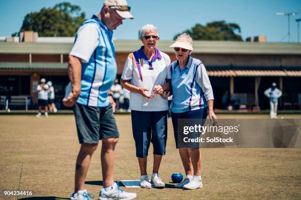 discussing the shot - lawn bowls stock pictures, royalty-free photos & images