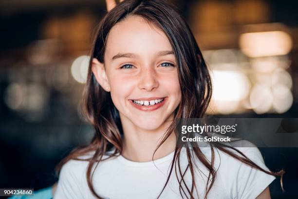 smiling young girl - brown hair stock pictures, royalty-free photos & images