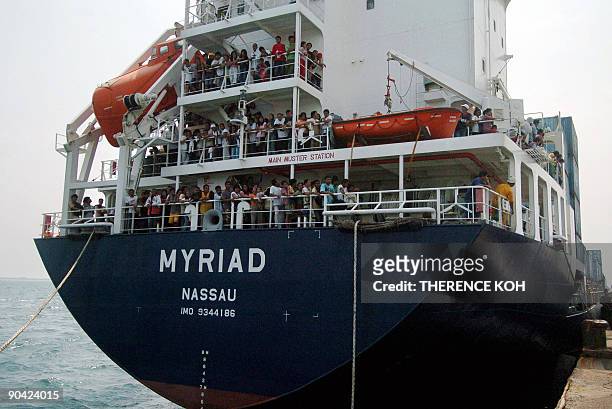 Survivors of Superferry 9 pack the decks of the cargo ship Myriad, owned by the Aboitiz company which also owns the Superferry 9, as it arrives at...