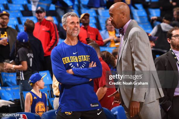 Bruce Fraser of the Golden State Warriors talks with Former NBA player, Bruce Bowen before the game against the LA Clippers on January 10, 2018 at...