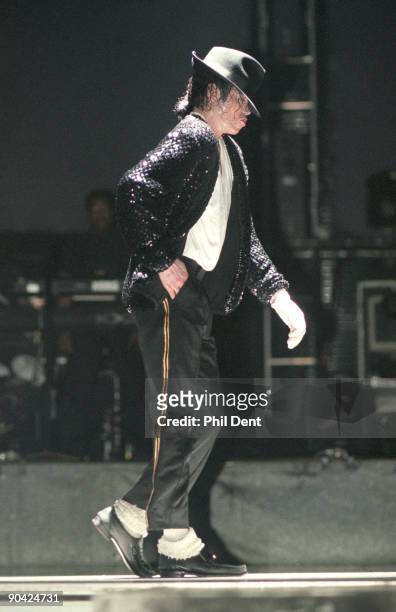 Michael Jackson moonwalks while performing on stage on his HIStory tour in December 1996.
