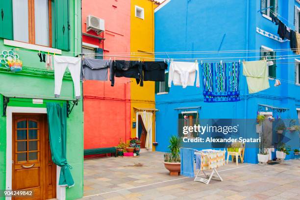 everyday life in colorful burano village, veneto, italy - piccoli elettrodomestici foto e immagini stock