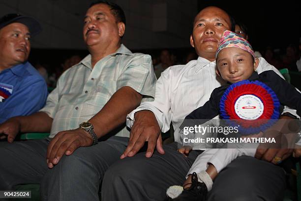 Nepalese teenager Khagendra Thapa Magar who weighs around 4.5 kg and is 51 cm tall, attends a function in Kathmandu on September 7, 2009. Magar will...
