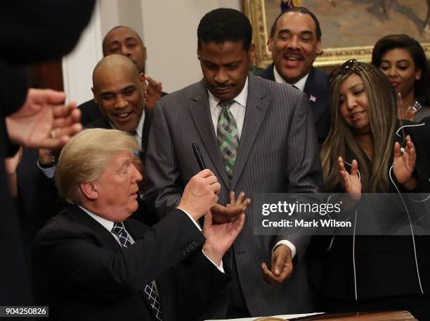 President Donald Trump gives Isaac Newton Farris, Jr. The pen he used to sign a proclamation to honor Martin Luther King, Jr. Day, in the Roosevelt...