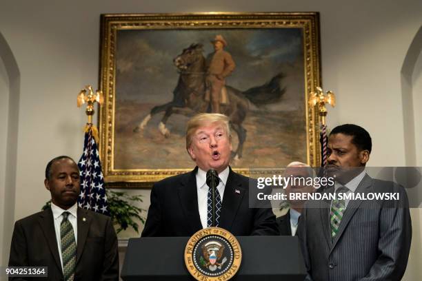 Secretary of Housing and Urban Development Ben Carson , US Vice President Mike Pence and Isaac Newton Farris Jr. Listen while US President Donald...