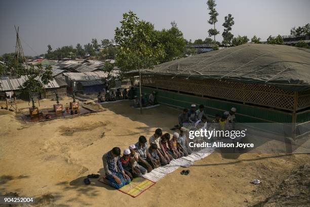 Rohingya refugees perform Friday prayer in Balukhali camp on January 12, 2018 in Cox's Bazar, Bangladesh. Over 650,000 Rohingya have crossed the...