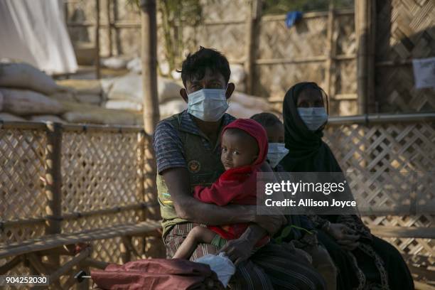 Rohingya refugees wait for treatment at a Samaritan's Purse diphtheria clinic in Balukhali camp on January 12, 2018 in Cox's Bazar, Bangladesh. Over...