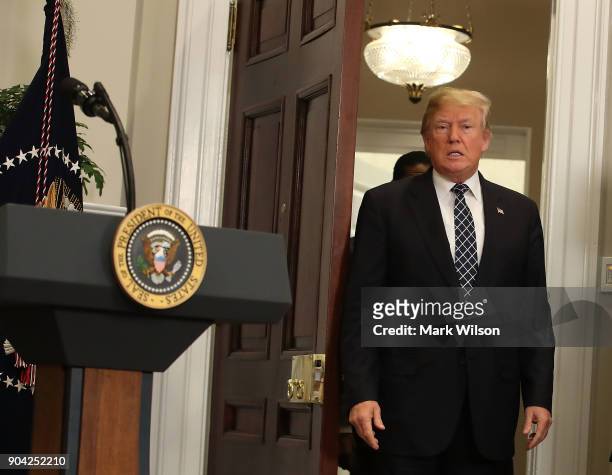 President Donald Trump walks into the Roosevelt Room to sign a proclamation to honor Martin Luther King, Jr. Day, in the Roosevelt Room at the White...