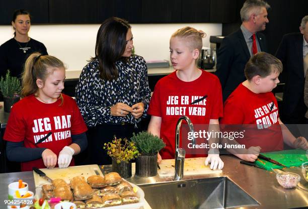 Crown Princess Mary of Denmark in the kitchen together with kids preparing food during the Princess visit at The Christmas Seal Foundation's home...