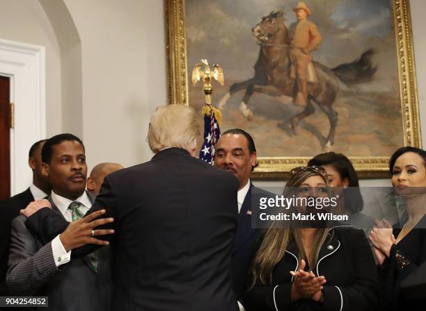 President Donald Trump greets members of the African American community after signing proclamation to honor Martin Luther King, Jr. Day, in the...