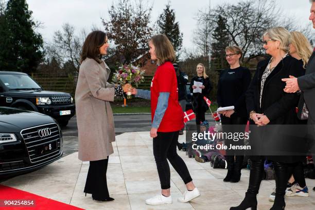 Crown Princess Mary of Denmark receives flowers at her arrival to the Christmas Seal Foundation home opening on January 12, 2018 in Roskilde,...