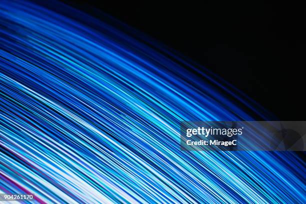 blue colored dynamic light trails - fan shape stock pictures, royalty-free photos & images