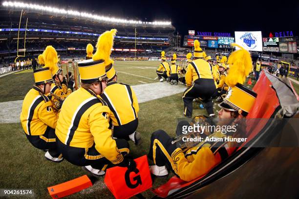 Member of the Iowa Hawkeyes marching band wait to perform prior to the New Era Pinstripe Bowl against the Boston College Eagles at Yankee Stadium on...