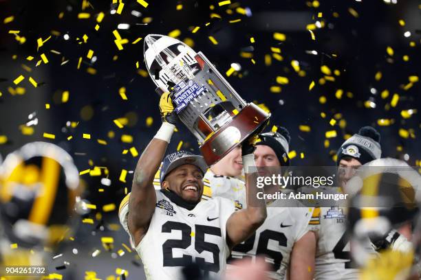 Akrum Wadley of the Iowa Hawkeyes celebrates after defeating the Boston College Eagles in the New Era Pinstripe Bowl at Yankee Stadium on December...