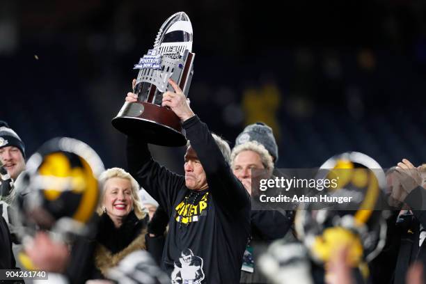 Head coach Kirk Ferentz of the Iowa Hawkeyes celebrates after defeating the Boston College Eagles in the New Era Pinstripe Bowl at Yankee Stadium on...