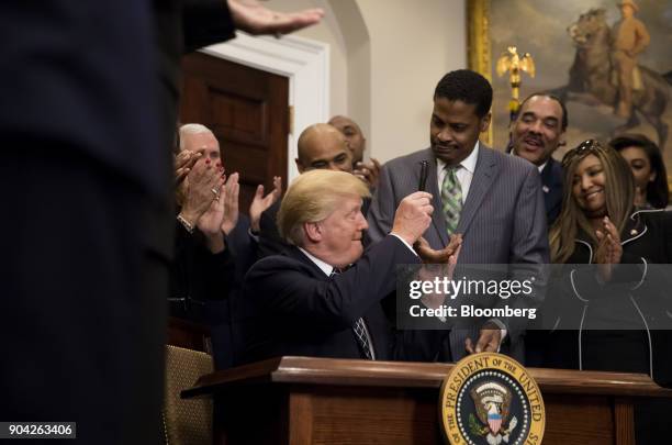 President Donald Trump gives Martin Luther King Jr.'s nephew Isaac Newton Farris Jr., chief executive officer of the Martin Luther King Jr. Center...