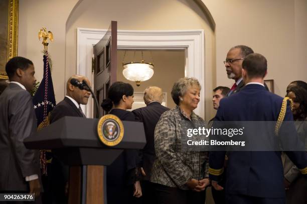 President Donald Trump, center, leaves after signing a proclamation for Martin Luther King Jr. Day in the Roosevelt Room of the White House in...