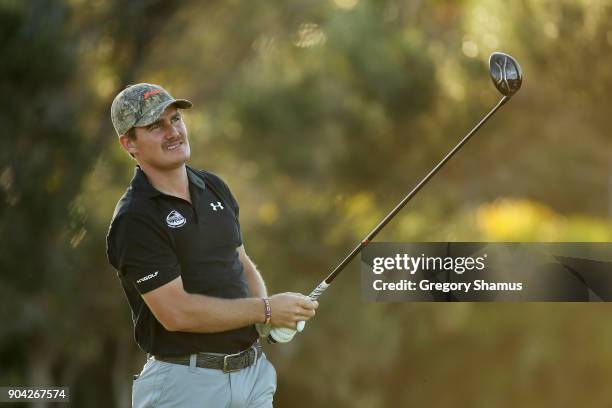 John Peterson of the United States plays his shot from the first tee during round two of the Sony Open In Hawaii at Waialae Country Club on January...