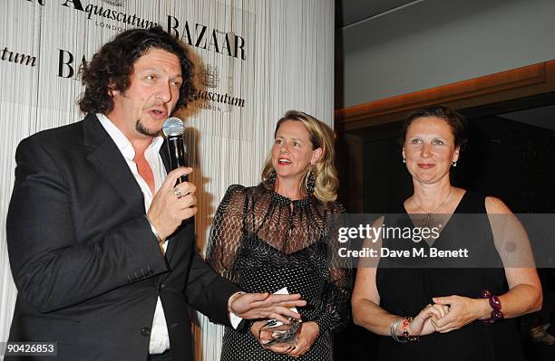 Jay Rayner, Angela Hartnett and guest attend the Harper's Bazaar Women Of The Year Awards at The Dorchester on September 7, 2009 in London, England.