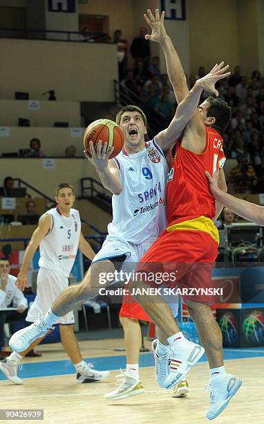 Serbia's Sefan Markovic fights for the ball with Carlos Cabezas of Spain during their 2009 European championship preliminary round, group C,...