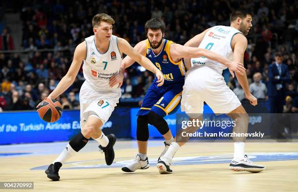 Luka Doncic, #7 of Real Madrid competes with Stefan Markovic, #9 of Khimki Moscow Region during the 2017/2018 Turkish Airlines EuroLeague Regular...