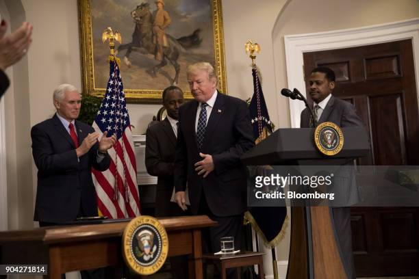 President Donald Trump, center, finishes speaking while U.S. Vice President Mike Pence, from left, Ben Carson, U.S. Secretary of Housing and Urban...