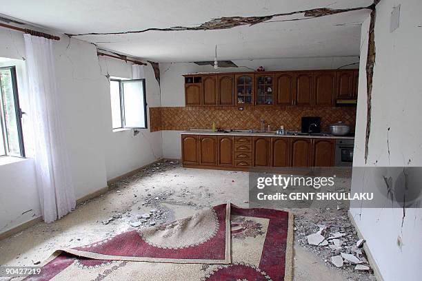 Damaged house is pictured following the recent earthquake in Shupenz near Peshkopi, some 200 km north east from Tirana on September 7, 2009. No...