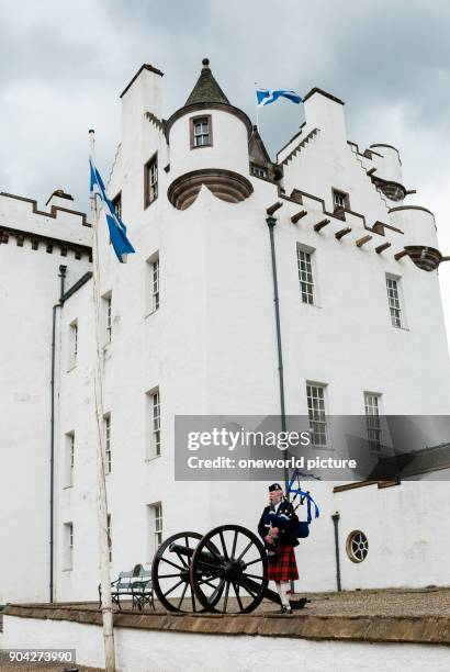 United Kingdom, Scotland, Perth and Kinross, Blair Atholl, bagpiper before Blair Castle, Blair Castle, The castle was built in 1269 by John Comyn in...