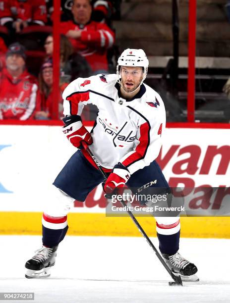 Taylor Chorney of the Washington Capitals controls the puck during an NHL game against the Carolina Hurricanes on January 2, 2018 at PNC Arena in...