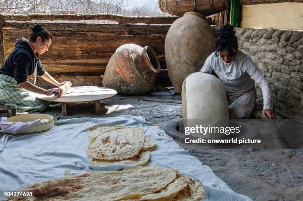 Armenia, Kotayk Province, Garni, Lavash is the typical Armenian bread. A wafer-thin dough is glued to the inside of a wood-fired stone oven. The...