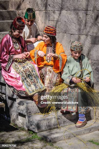 Armenia, Aragatsotn Province, Ohanavan, Armenian girls dressed in dressing wreaths, preparations for the Easter festival.