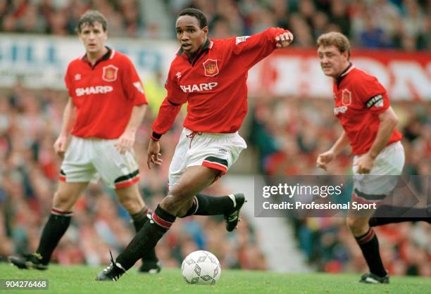 Paul Ince of Manchester United in action, watched by Mark Hughes and Steve Bruce, circa 1995.