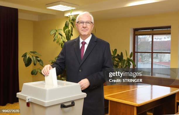 Jiri Drahos, former head of the Czech Academy of Sciences and candidate for the upcoming presidential election casts his ballot during the first...