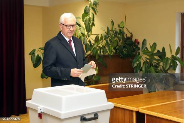 Jiri Drahos, former head of the Czech Academy of Sciences and candidate for the upcoming presidential election casts his ballot during the first...