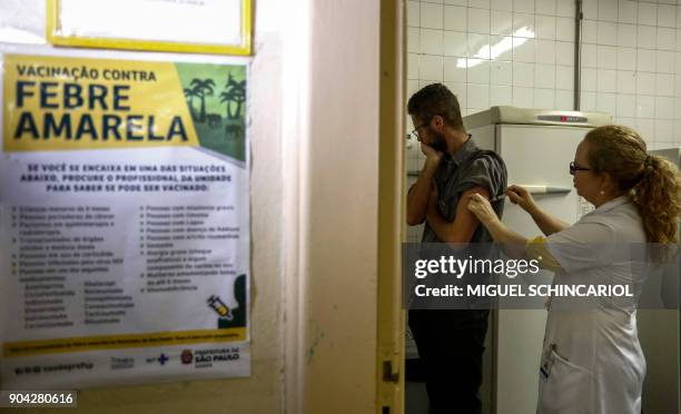 Man gets a vaccine against yellow fever at an outpatient clinic in Sao Paulo, Brazil, on January 12, 2018. Brazil stepped up prevention measures...