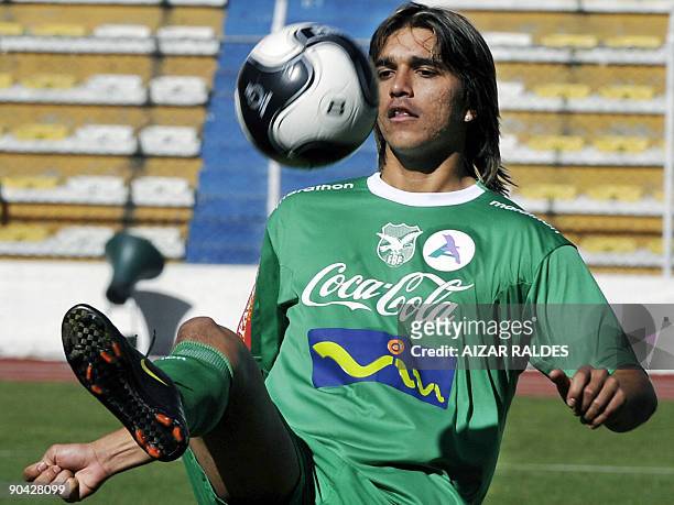Bolivian footballer Marcelo Martins controls the ball during a training session on September 7, 2009 at the Hernando Siles stadium in La Paz. Bolivia...