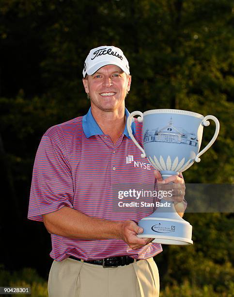 Steve Stricker holds the winner's trophy after the final round of the Deutsche Bank Championship held at TPC Boston on September 7, 2009 in Norton,...
