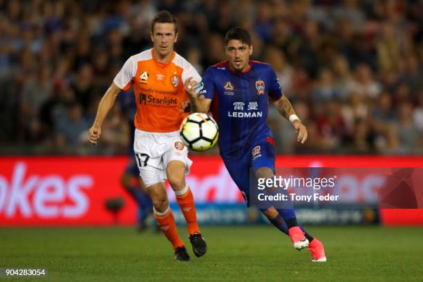 Dimitri Petratos of the Jets and Matthew McKay of the Roar to contest the ball during the round 16 A-League match between the Newcastle Jets and the...