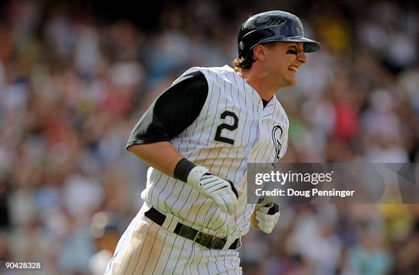 Troy Tulowitzki of the Colorado Rockies winces as he heads for first on his RBI single that scored Eric Young Jr. To tie the game 3-3 in the seventh...