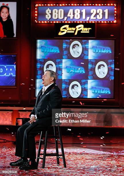Entertainer Jerry Lewis tries to catch confetti with his tongue at the end of the 44th annual Labor Day Telethon to benefit the Muscular Dystrophy...