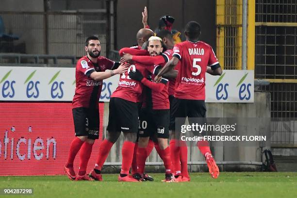 Guingamp's players celebrate after scoring a goal during the French L1 football match between Strasbourg and Guingamp on January 12, 2018 at the...