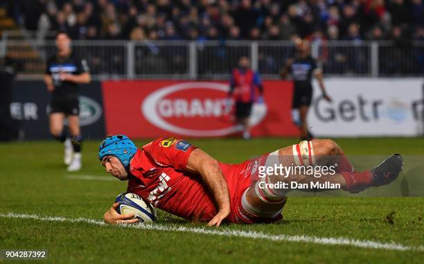 Tadhg Beirne of Scarlets dives over to score his side's first try during the European Rugby Champions Cup match between Bath Rugby and Scarlets at...